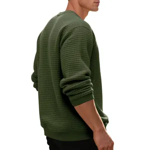 Detailed view of the waffle knit texture on this dark green crew neck sweatshirt for men
