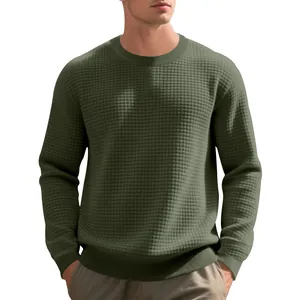Detailed view of men's olive green waffle knit sweatshirt showing unique fabric texture