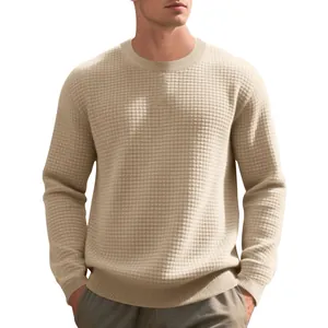 Detailed view of men's beige waffle knit sweatshirt with elegant small checkered jacquard texture.