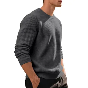 Close-up of men's grey waffle-knit crewneck sweatshirt with jacquard texture