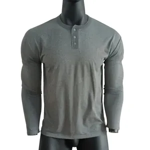 Detailed view of the crew neck and button placket on a grey men's long sleeve Henley shirt