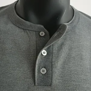 Close-up detailed view of grey men's Henley t-shirt neckline with three buttons