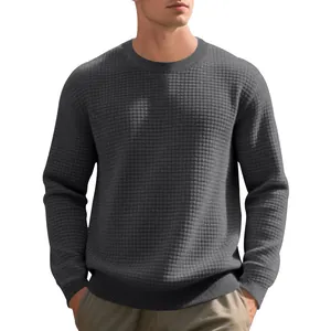 Detailed texture of the grey waffle jacquard fabric on this men's long sleeve crewneck sweatshirt