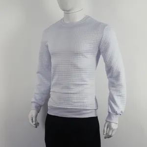 Close-up of white long sleeve sweatshirt featuring a distinct square jacquard grid texture