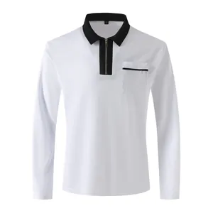 Detail of a white long-sleeve polo shirt with a black contrast collar and half-zipper.
