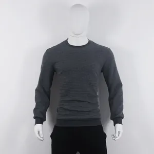 Detailed view of a men's charcoal grey sweatshirt featuring a waffle jacquard texture.