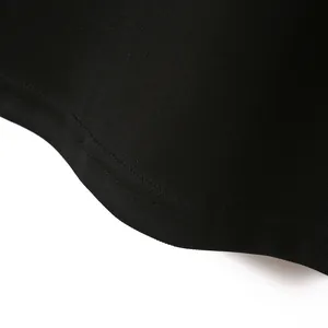 Detailed close-up showing the high-quality black pique fabric texture and neat stitching