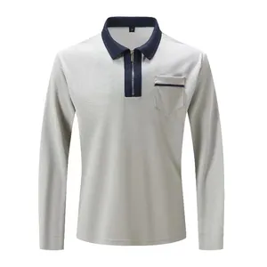 Detail shot of men's grey long sleeve polo shirt with navy contrast collar and half zip