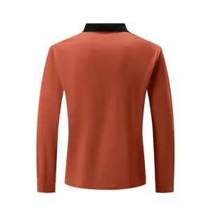 Men's slim fit long-sleeved polo shirt in burnt orange with black collar, back view detail.