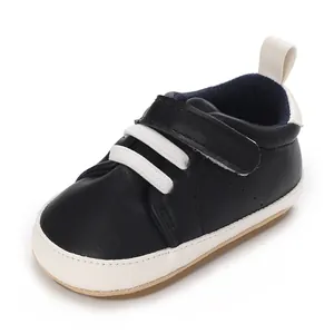 Navy blue infant boy sneaker with velcro strap and soft white sole for pre-walkers