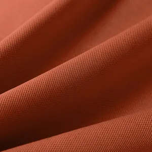 Close-up detail of the breathable pique knit fabric on this men's autumn polo shirt