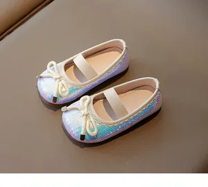 Detail of girls glitter sequin flat shoes with bow knot and elastic strap for party