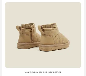Rear view of beige quilted toddler snow boots with side zipper and knit collar details.