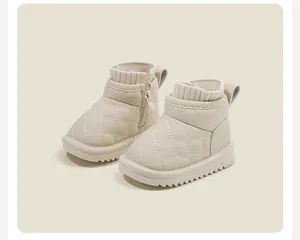 Detailed view of beige quilted baby snow boots with knit collar and side zipper