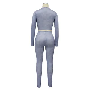Back view of a dusty blue ribbed long-sleeve crop top and matching leggings sports set