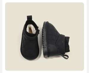Detailed macro view of black quilted toddler snow boots featuring warm faux fur lining