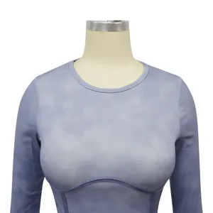 Close-up detail of the ribbed knit fabric and curved stitching on this blue sports top