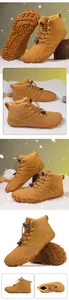 Detailed view of tan fleece-lined winter hiking boots on snowy background