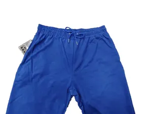 Detailed close-up of men's blue casual sweatpants featuring a deep side pocket