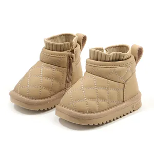 Warm beige toddler snow boots with quilted stitching and plush lining for winter