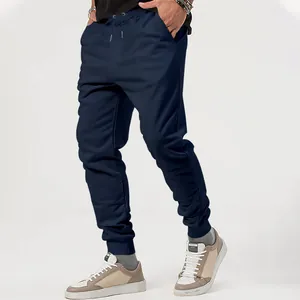 Detailed view of navy blue men's jogger sweatpants featuring an adjustable waist