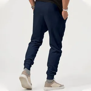 Detailed back view of men's navy blue casual tapered jogger pants for outdoor sports