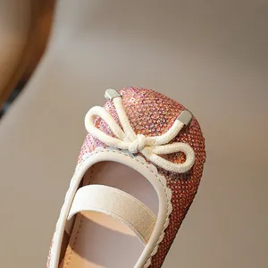 Girls sparkling rose gold sequin princess flats with white bow and elastic strap