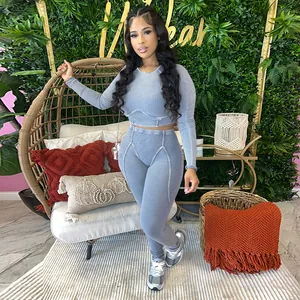 Sexy women's two-piece ribbed knit casual outfit with long sleeve crop top and leggings