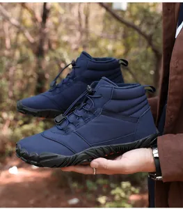 Detailed close-up view of navy blue winter outdoor boots with warm fleece lining.