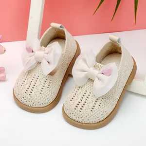 Beige toddler girl princess walking shoes with mesh knit and large bow detail