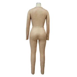 Back view of a beige ribbed long-sleeved two-piece tight-fitting set for women