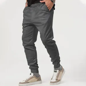 Detailed side view of gray men's outdoor casual jogger pants featuring elastic cuffs