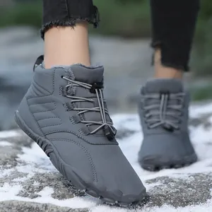 Warm grey winter snow boots with thick fur lining for outdoor hiking and walking