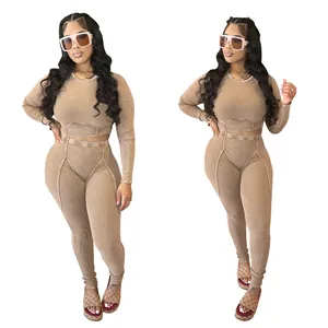 Macro view of tan ribbed two-piece set with long-sleeve crop top and high-waist leggings