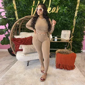 Chic tan ribbed knit two-piece set featuring a long sleeve crop top and matching leggings