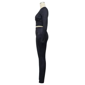 Side view of black ribbed long sleeve crop top and leggings sportswear set