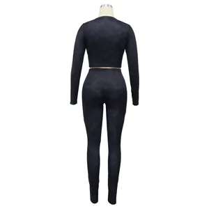 Full back view of a dark gray ribbed long-sleeve crop top and leggings athletic set
