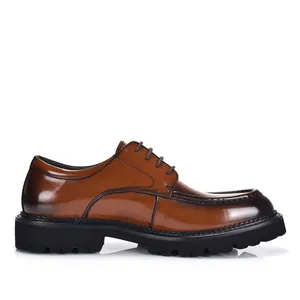 Classic brown polished leather Derby dress shoe with rugged rubber sole, side profile view.