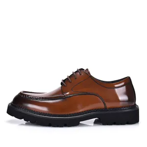 Side profile of brown patent leather men's derby shoes with a thick black lug sole