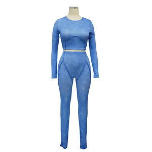 Detail view of a blue ribbed long sleeve athletic two-piece set for women.
