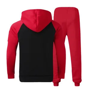 Back view of men's red and black color block fleece hoodie and sweatpants set