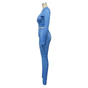 Side view of a blue ribbed two-piece activewear set with long sleeves and leggings
