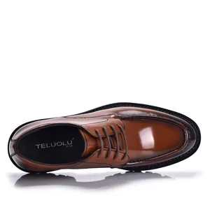 Detailed top-down view of a classic glossy brown leather dress shoe with lace-up design
