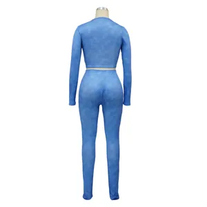 Back view of a blue ribbed two-piece sports set with marbled texture and long sleeves