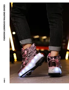 Close-up detail of pink metallic LED roller shoes with 3D wings for kids walking and skating.