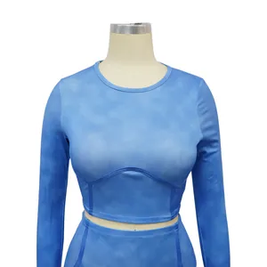 Close-up detail of a women's blue ribbed long sleeve sports crop top on a mannequin