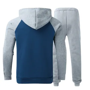 Rear view of two-piece men's fleece tracksuit set with gray hood and blue body panel