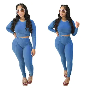 Two views of a blue ribbed long-sleeve crop top and legging set on a white background.