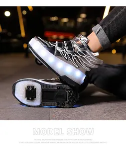 Detailed view of silver kids' LED roller shoes with wing design and lights.