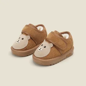 Cozy brown infant snow boots featuring a cute bear face and warm fleece lining.